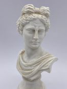 A small Apollo bust sculpture