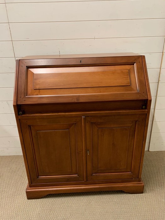 A bureau, fall front opening to reveal pigeon holes and drawers (H101cm W85cm D45cm)