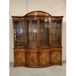 A large satin wood display cabinet with pediment top glazed doors and cupboard under (2parts) (