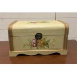 A small painted wooden trunk decorated with flowers (H25cm W45cm D29cm)