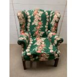 An 18th century wing back chair with mahogany frame