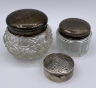 Two hallmarked silver lidded pots and a small silver, hallmarked pill box.