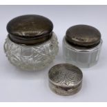 Two hallmarked silver lidded pots and a small silver, hallmarked pill box.