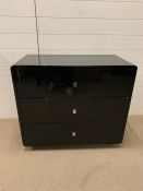 Three drawer black lacquer chest of drawers (H70cm W82cm D40cm)