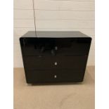 Three drawer black lacquer chest of drawers (H70cm W82cm D40cm)