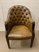 A button back leather club chair