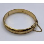 A 9ct gold bracelet (Total weight 13g)