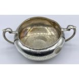 A two handles silver, hallmarked, two handled bowl. Sheffield 1934, by Cooper Brothers & Sons Ltd (