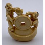 A signed netsuke in ivory