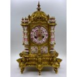 A French porcelain and gilt Eight Day clock