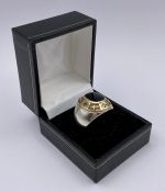 A Silver American College style ring with inset diamond stones and gold metal setting.