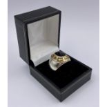 A Silver American College style ring with inset diamond stones and gold metal setting.