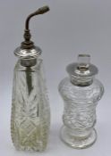 Two silver topped cut glass perfume bottles