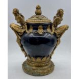 A Lidded vase with carved figure handles by REGENCY FINE ARTS (25 cm H)