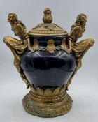 A Lidded vase with carved figure handles by REGENCY FINE ARTS (25 cm H)