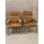 A pair of Mid Century tubular frame lounge chairs in original fabric (H100cm W62cm D60cm)
