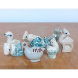 A group of eight ceramic animals, birds and sheep, (5 cm largest). (8)