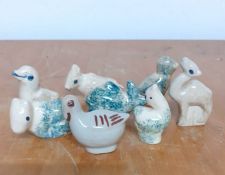 A group of eight ceramic animals, birds and sheep, (5 cm largest). (8)