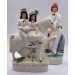 A pair of vintage Staffordshire pottery (style) figures, compromising of "Returning home" and a