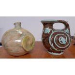 A pair of pottery vases and a charger by Gorbon Isil (signed: Mural?), a Burleigh Ware and another