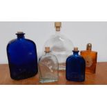 A collection of five empty glass bottles, (21.5 cm largest). (5)