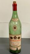 A large vintage cognac bottle by Courvoisier