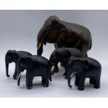 Four carved elephant figures