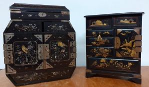 A pair of early 20th century Japanese black lacquered table cabinets, with gilt and mother of