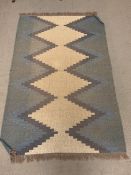 A woven rug with diamond pattern (197cm x 200cm)