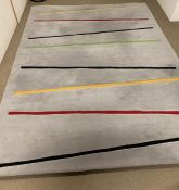 A grey thick pile rug, with strips of colour (300cm x 225cm)