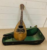 A cased Mandolin with tortoiseshell inlay AF (60cm x 14cm)