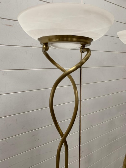 A pair of contemporary brass effect floor standing lamps with glass shades - Image 2 of 4