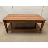 A solid coffee table with shelf under (H47cm W112cm D57cm)