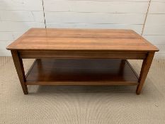 A solid coffee table with shelf under (H47cm W112cm D57cm)