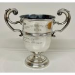 A two handled silver cup on stand (Total weight of cup 368g)