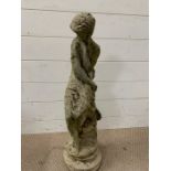 A garden statue of a goddess sitting on a rock (H69cm)