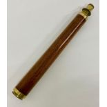 A single drawer wooden and brass telescope