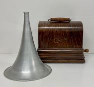 An Edison Gem phonograph in oak case with aluminium horn