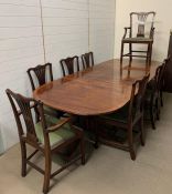 An impressive George III style triple pedestal dining table