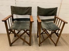 A pair of vintage folding director's chairs with green cord upholstery