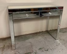 A mirrored console table (H76cm W100cm D36cm)