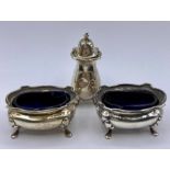 A set of hallmarked silver salts with blue glass liners AF Hallmarked Birmingham 1923.