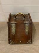 A mahogany and brass coal scuttle