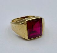 A 10k gold signet ring with red coloured glass stone (Total Weight 7g) Size S