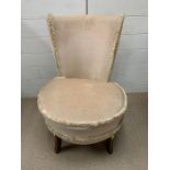 A low bedroom chair on mahogany legs (H76cm W54cm SH38cm)