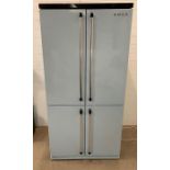 A Smeg two door refrigerator and freezer (H187cm W93cm D68cm)