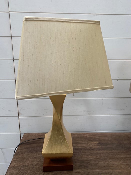 A pair of contemporary table lamps with twisted centre on wooden base and cream shades - Image 3 of 4