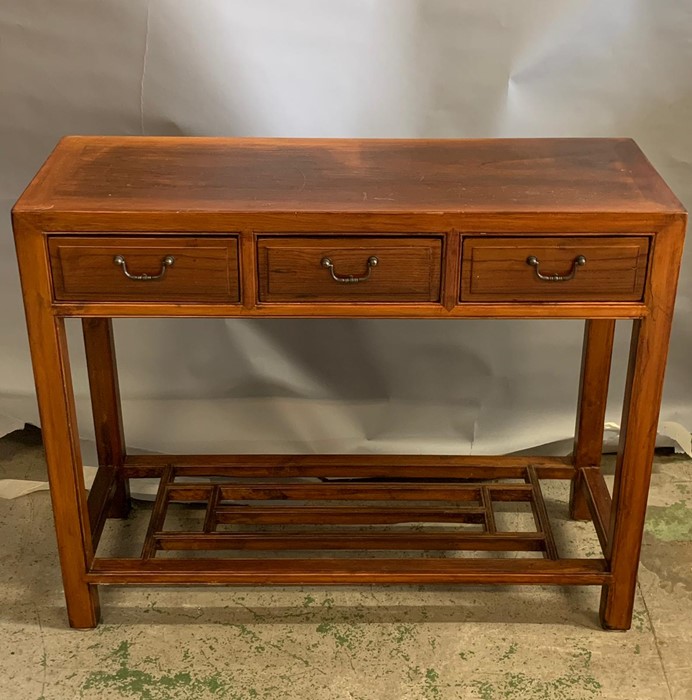 An oriental style hard wood console table with three drawers to centre and shelf (H80cm W100cm - Image 2 of 4