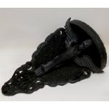 A Carved wall bracket, ebonised wood with bird theme, possibly Indo Chinese.