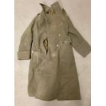 A WWII British Military coat with Royal Artillery buttons.